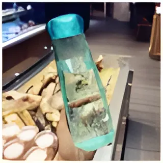 "Transparent crystal glass water bottle with infuser compartments for fruit and herbal drinks, designed for healthy hydration"
