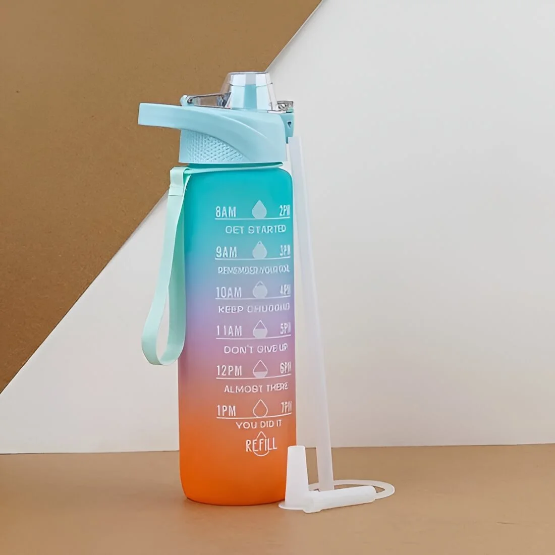 Colorful gradient motivational water bottles with time markers and measurement scale, leak-proof reusable gym bottles with flip-top lids, straw caps, and carrying straps on display.