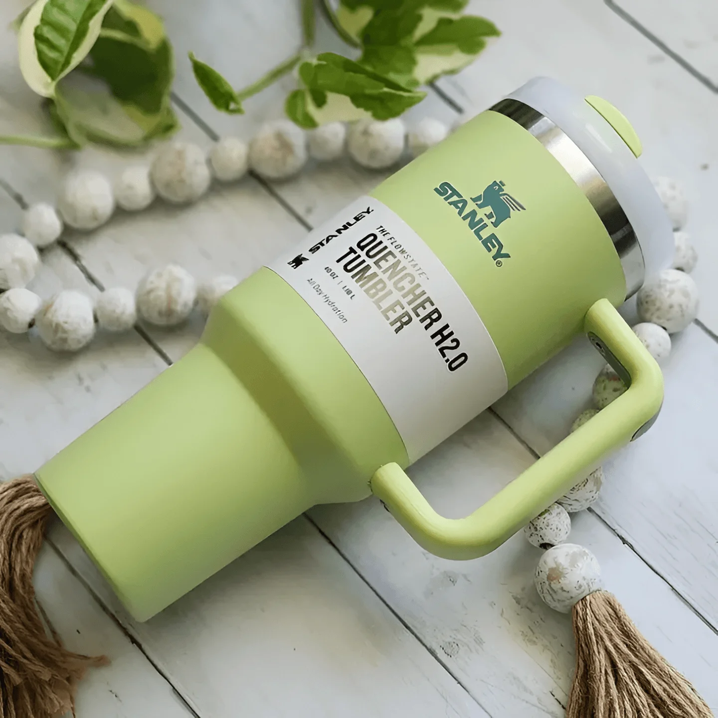 "40oz stainless steel tumbler with ergonomic handle, leak-resistant lid, and double-wall insulation."